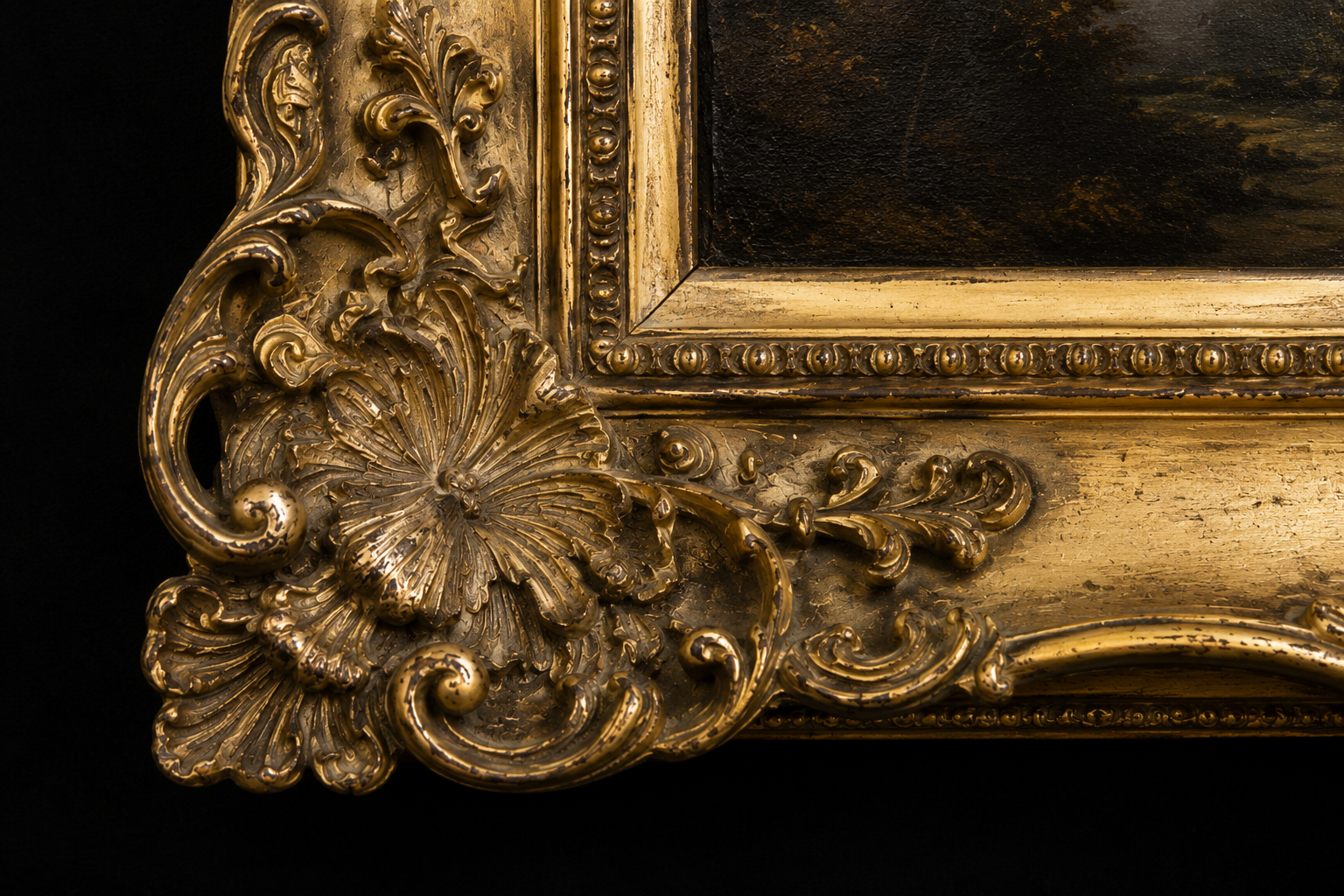Close view of a nineteenth-century European gilt frame surrounding an antique oil painting, highlighting craftsmanship, ornament, and historical character.