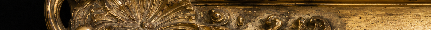 Close view of a nineteenth-century European gilt frame surrounding an antique oil painting, highlighting craftsmanship, ornament, and historical character.